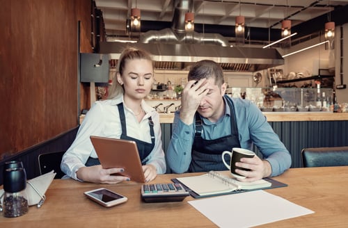 Depressed male and female entrepreneurs overwhelmed by finance problems