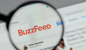 Buzzfeed website header through a magnify glass 