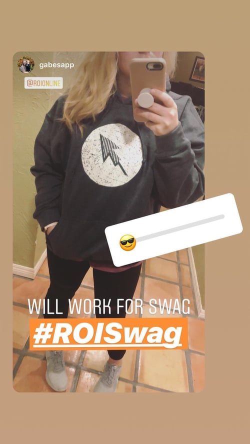 ROI employee in ROI gray hoodie